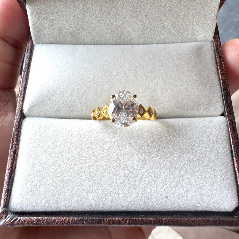 Oval Cut Man Made Diamond Ring with Side Stones