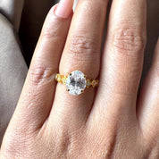 Oval Cut Man Made Diamond Ring with Side Stones