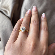 Oval Cut Man Made Diamond Ring with Side Stones