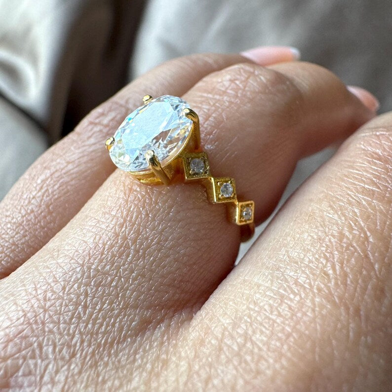 Oval Cut Man Made Diamond Ring with Side Stones