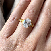 Oval Cut Man Made Diamond Ring with Side Stones